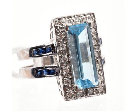 Art Deco-style diamond, blue topaz and blue sapphire cocktail ring with a large rectangular step cut blue topaz surrounded by