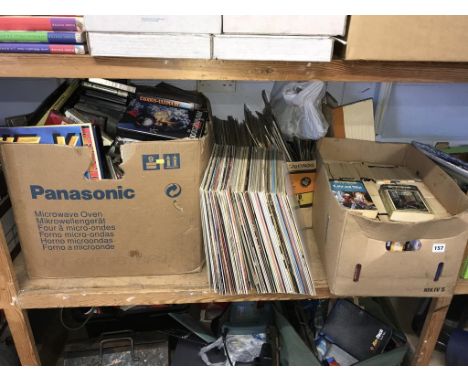 A shelf of assorted, to include LPs, Vintage video games etc.