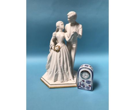 A Franklin Flint group 'To Have and to Hold' and a boxed clock