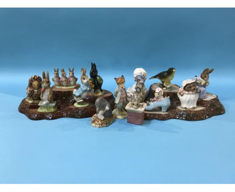 Twelve Beswick Beatrix Potter figures, a Beswick bird and two stands
