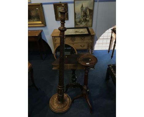 A half moon table, standard lamp and plant pedestal