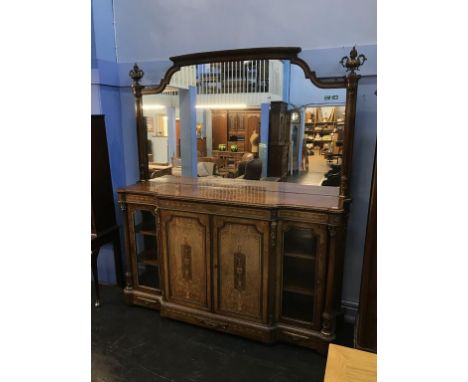 A fine quality Victorian walnut mirror back credenza, in the manner of Gillows, the mirror back surmounted with urns, reeded 