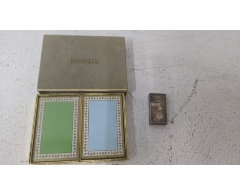 A double pack of Tiffany & Co playing cards boxed and a silver plated razor blade case/vesta case together with a collection 