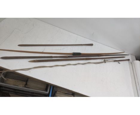Two vintage spears together with a traditional longbow A/F, with a horse riding whip and one other spear without handleLocati