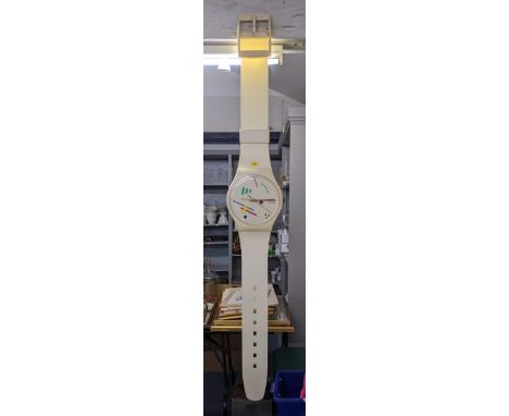 A large Swatch clock in the form of a wristwatch, 210cm long approxLocation:If there is no condition report shown, please req