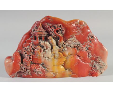 A GOOD CHINESE CARVED HARDSTONE BOULDER. 10ins wide.