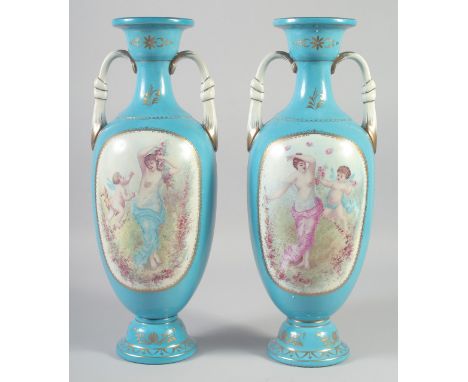 A PAIR OF CONTINENTAL LIGHT BLUE CLASSICAL SCENE VASES AND COVERS. 18ins high.