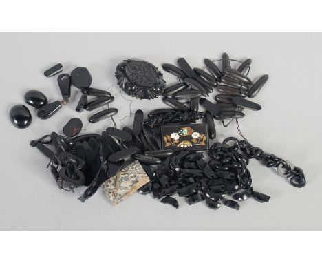 A VICTORIAN CARVED JET BROOCH, A NECK CHAIN, ETC.