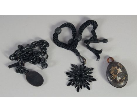 A JET FOB CHAIN, PENDANT AND TORTOISESHELL LOCKET. (3).
