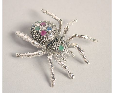 A LARGE SILVER RUBY, SAPPHIRE  AND EMERALD SPIDER BROOCH.