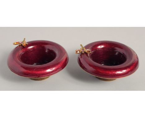 JAY STRONGWATER. A PAIR OF ENAMEL CIRCULAR BOWLS with a butterfly on the rim. 4ins diameter.