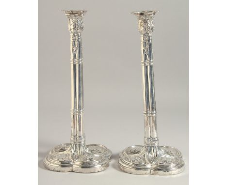 A PAIR OF GEORGE III CLUSTER COLUMN SILVER CANDLESTICK on loaded bases. 11ins high.  London 1774.  Maker F H &amp; I C.