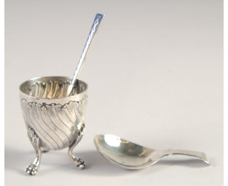A SMALL ART NOUVEAU SILVER EGG CUP on three claw feet, blue enamel spoon. George III silver caddy spoon, Birmingham, 1781.  (