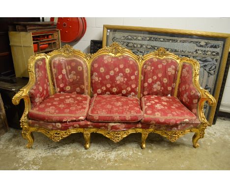 A FRENCH STYLE GILTWOOD SOFA. 7ft long.