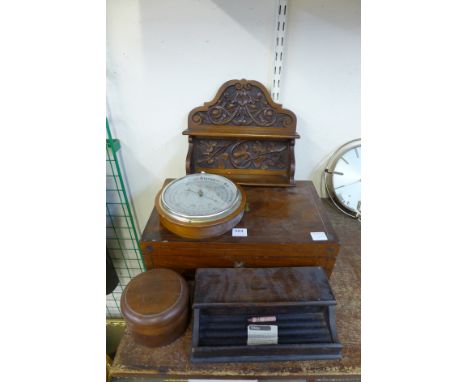 A writing box, a carved oak wall rack, a desk tidy, a round box and a barometer