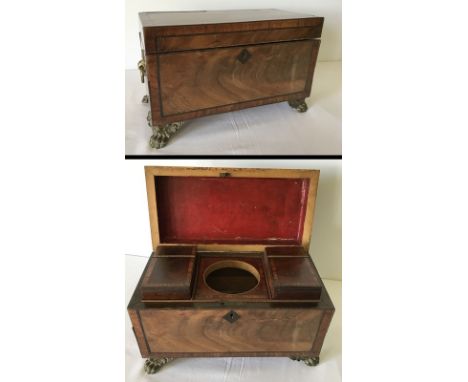 A mahogany tea caddy with gilt metal animal claw feet and handles. 2 hinged lidded interior compartments. Mixing bowl missing
