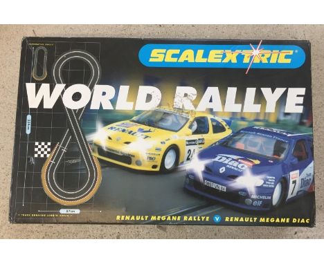 A boxed Scalextric World Rally, with Renault Megane cars. Appears complete & in good condition. 
