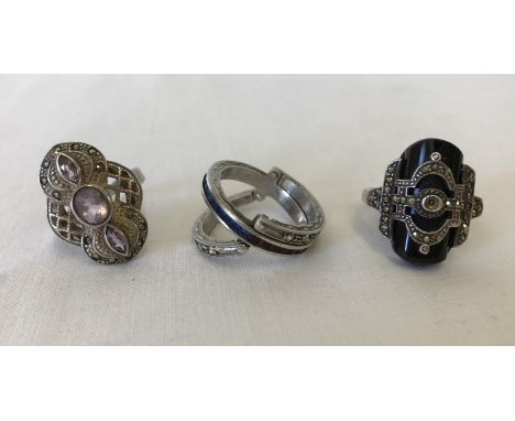 3 925 silver rings dress rings. 2 are Art Deco design set with marcasite's and the 3rd has hinged outer panels so the ring lo