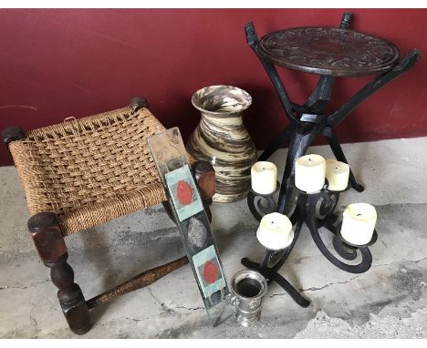 A collection of assorted items. Comprising an African wooden table, a wood & raffia stool, an iron candelabra, a glass wall d