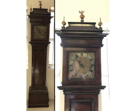 A walnut veneer long case clock by Rich, Wright and Witham. Complete with pendulum and weights. With decorative metal roundel
