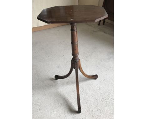 A dark wood tripod tip top wine table. With turned pedestal and octagonal shaped top, A/F. Approx 71cm tall.