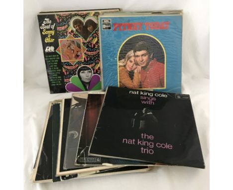 A quantity of approx. 40 vinyl records. To include Frank Sinatra, John Denver, Duane Eddy, Michael Jackson & Queen. 