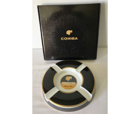 A boxed ceramic Cohiba cigar ashtray by Bidasoa. 40th anniversary in black. 23cm diameter.