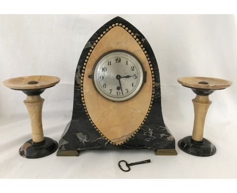 Art Deco style marble clock garniture in working order. Bi-colour marble clock and 2 matching pillars. Chip to the top of one