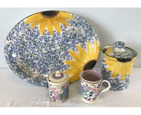 4 items of Poole pottery. Comprising storage jar and matching serving plate. Jam pot with matching cream jug. 