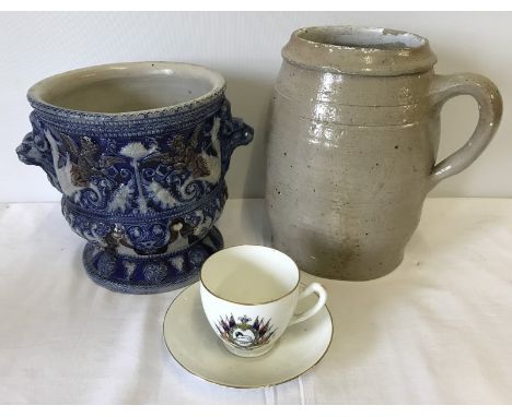 A Westerwald planter 19cm tall (a/f - hairline crack). Together with a large stoneware pot with handle 23cm tall (chips to ri