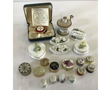 A collection of trinket/pill boxes. To include ceramic, enamel and Toye, Kenning and Spencer. 