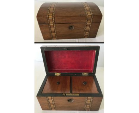 A small mahogany tea caddy with 2 bands of inlaid banding. 2 lidded compartments. 17.5 x 10 x 9cm.