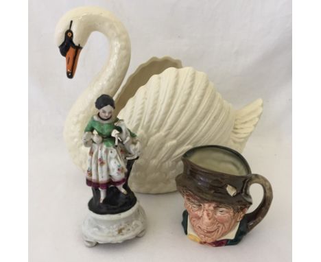 A small collection of ceramics. Comprising of a large Dartmouth Devon  Swan planter, a figure of a young girl with a lamb and