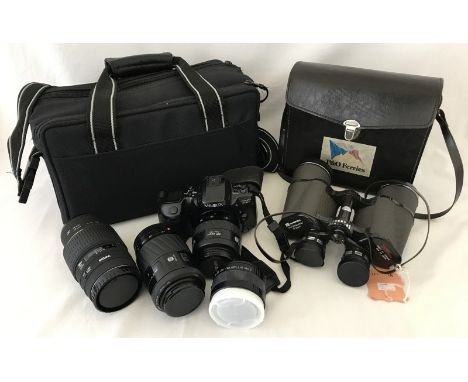 A Minolta Dynax 500si camera with 3 lenses and carry case. Together with a cased set of Hanimex fully coated optics binocular