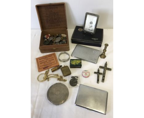A small box of assorted items. To include Player's Navy Cut Cigarettes box, compact, and badges. 