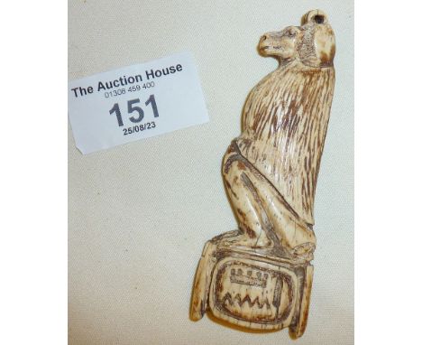 Ancient Egyptian carved cow bone funerary amulet in the form of Thoth as a seated baboon. With hieroglyphics in cartouche und
