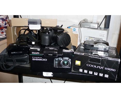 A Nikon D70's camera, a Nikon Coolpix, a Minolta Dilmage G600 and an Olympus AF1 Twin camera (boxed)