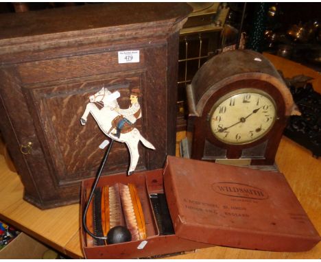 Oak spice cupboard, mantle clock, painted tin rocking cowboy and box of show brushes