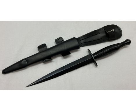 A Royal Marine current day issue dagger with sheath. With war department arrow. Stamped "Made In Sheffield". 