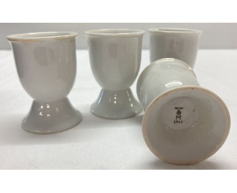 A set of 4 WWII style Kriegsmarine ceramic egg cups.  