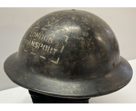 A WWII style London transport Bakelite helmet.  