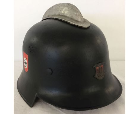 A WWII style German Reichsbahn Fire Service helmet with the city crest of Hamburg to the front.  