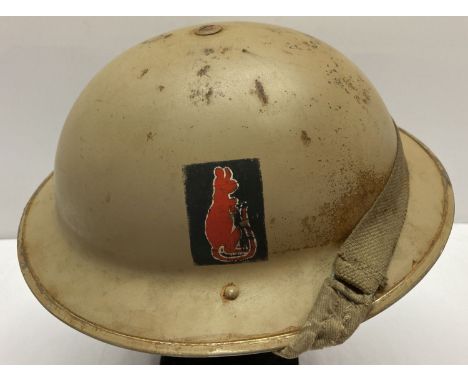 A WWII style British 8th Army helmet with liner.  