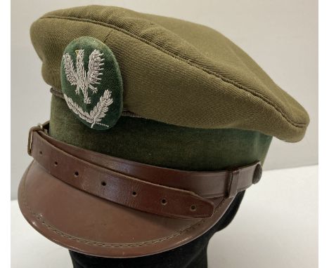 A Cold war style Eastern European peaked army cap.  