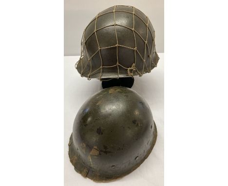 A WWII style US M1 helmet with captains bars. Front split seam, swivel bale (both loops missing). Complete with Capac liner a