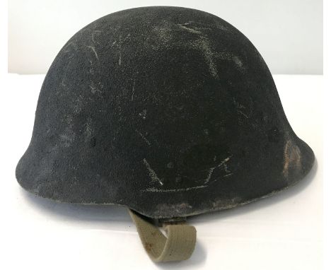 A Yugoslav Kevlar helmet, circa 1980's. Complete with suspension lining and canvas chin strap. From a private collection.