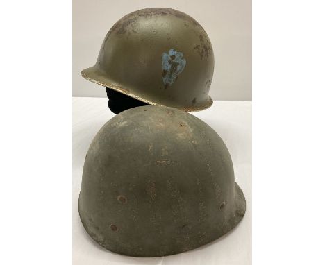 A WWII style US M1 36th Infantry helmet with hand painted insignia. Front split seam, swivel bale and liner (with no webbing)