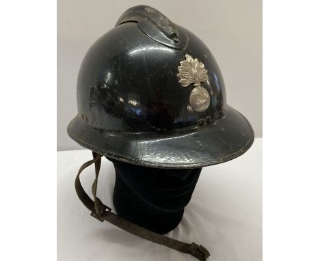 A WWII style French M26 Casque Adriane helmet with liner. Believed to have been worn during the Vichy Government rule in Germ