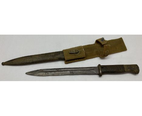 A WWII style German Africa Corps Mauser K.98 bayonet with D.A.K. scabbard and logo engraved to hilt.  