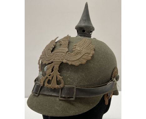 A WWI style Imperial German ersatz felt pickelhaube helmet.  